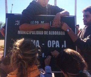 Prepping the sign. The Nueva Alborada Municipality is getting some beautification 